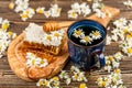 Honeycomb and chamomile tea Royalty Free Stock Photo
