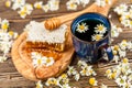 Honeycomb and chamomile tea Royalty Free Stock Photo