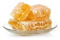 Honeycomb in glass dish on white background