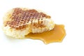 Honeycomb with honey dipper isolated on white background Royalty Free Stock Photo
