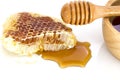 Honeycomb with honey dipper isolated on white background Royalty Free Stock Photo