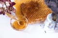 Honeycomb, honey, dried flowers.