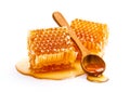Honeycomb with honey spoon isolated on white background