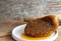 Honeycomb pieces close-up on the white plate with fresh liquid honey golden color beautiful from a bee hive. Food and healthy Royalty Free Stock Photo