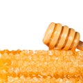 Honeycomb with Wooden Honey Dipper, isolated on white background Royalty Free Stock Photo