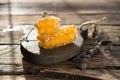 Honeycomb and wooden honey dipper. Raw honey. Natural honey, closeup view Royalty Free Stock Photo