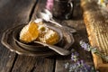 Honeycomb and wooden honey dipper. Raw honey. Natural honey, closeup view Royalty Free Stock Photo