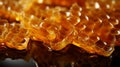 Honeycombs with honey on it and drops of honey on it