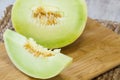 Honeydew Melon Slice on Wooden Cutting Board Royalty Free Stock Photo