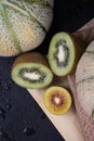 Honeydew melons,a lemon half, green and yellow chopped kiwis in a frame. Royalty Free Stock Photo