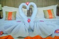 Honeymoon Bed Suite decorated with flowers and towels.The swan towels on the bed in a hotel room