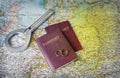 Honeymoon concept. Wedding rings with passports on the map