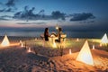 Honeymoon couple is having a private, romantic dinner