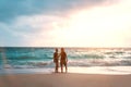 Honeymoon couple in love embracing and enjoying ocean view at beach Royalty Free Stock Photo
