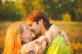 Honeymoon couple romantic in love at field and trees sunset. Newlywed happy young couple embracing enjoying nature Royalty Free Stock Photo