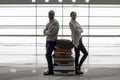 Pleasant romantic couple is waiting for flight with baggage Royalty Free Stock Photo