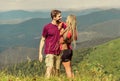 Honeymoon in highlands. Two hearts full of love. Beautiful couple embracing landscape background. Couple in love summer