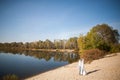 Honeymoon of just married wedding couple. happy bride, groom standing on beach, kissing, smiling, laughing, having fun on beach Royalty Free Stock Photo