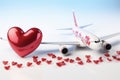 Honeymoon or travel lover concept airplane model and red hearts Royalty Free Stock Photo