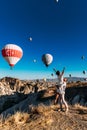 Honeymoon trip. Couple in love among balloons. A man proposes to a girl. Couple in love in Cappadocia. Couple in Turkey. Royalty Free Stock Photo