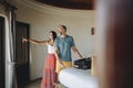 Honeymooners checking in to a hotel room Royalty Free Stock Photo