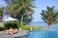 Honeymooners relaxing on a poolside in Rarotonga Cook Islands