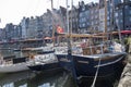 Traditional houses and boats in the old harbor of Honfleur. Normandy, France Royalty Free Stock Photo
