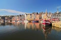 Honfleur harbour in Normandy France. Color houses and their reflection in water Royalty Free Stock Photo