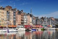 Honfleur harbour in Normandy France. Color houses and their reflection in water