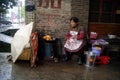 Hong Jiang, China: are fried snacks in elderly women Royalty Free Stock Photo