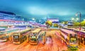 HONG KONG - APRIL 2014: Public buses in main terminal at night. Royalty Free Stock Photo