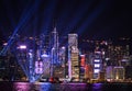 Night View of Hong Kong City Skyscrapers with Flashing Lights from Victoria Harbour Music Show `Symphony of Lights`