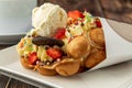 Hong kong or bubble waffle with ice cream, fruits, chocolate sauce and colorful candy Royalty Free Stock Photo