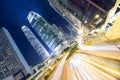 Hong Kong business district at night with light trails Royalty Free Stock Photo