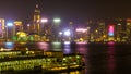 HONG KONG, CHINA - DECEMBER 8, 2016: Hong Kong city skyline at night over Victoria Harbor with clear sky and urban skyscrapers, Royalty Free Stock Photo