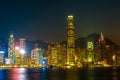 HONG KONG, CHINA - DECEMBER 8, 2016: Hong Kong city skyline at night over Victoria Harbor with clear sky and urban skyscrapers, Royalty Free Stock Photo