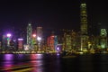 HONG KONG, CHINA - DECEMBER 8, 2016: Hong Kong city skyline at night over Victoria Harbor with clear sky and urban skyscrapers, Royalty Free Stock Photo