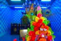 HONG KONG, CHINA - JANUARY 26, 2017: Close up of an oblation of plastic flowers inside of Tsz wan temple, in Hong Kong