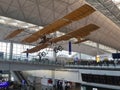 Hong Kong International Chek Lap Kok Airport interior. Vintage plane suspended under ceiling