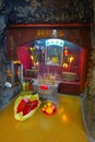 HONG KONG, CHINA - JANUARY 26, 2017: Tsz wan temple, with a hell representation, indoor view with some oblation in Hong