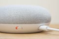 Hong Kong, China - 11 March, 2018: Close-up of the physical microphone switch button of the Google Home Mini Chalk color