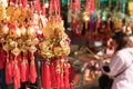 Hong Kong, China - March 19, 2018: Golden calabash plastic hang for believed to bring luck at Wong Tai Sin Temple with traveler in