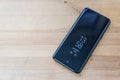 Hong Kong, China - 14 March, 2018: Samsung Galaxy S9 with `Always on Display` on a wooden surface
