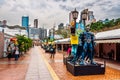 Hong Kong Avenue of Comic Stars, Kowloon Park. Urban skyline background