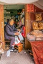 Old lady sells dried fish out of shack in Tai O, Hong Kong China