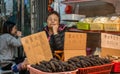 Sleeping lady sells sea cucumbers in Tai O, Hong Kong China