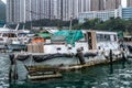 Closeup of delapidated Houseboat in harbor of Hong Kong, China