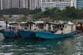 Closeup of three Houseboats in harbor of Hong Kong, China