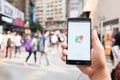 HONG KONG, CHINA - 15 MAY 2016: A man hand holding screen shot of google maps app showing on LG G4. Google Maps is most popular ma Royalty Free Stock Photo