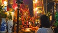 HONG KONG, CHINA- OCTOBER, 2, 2017: female worshiper praying at man mo temple in hong kong